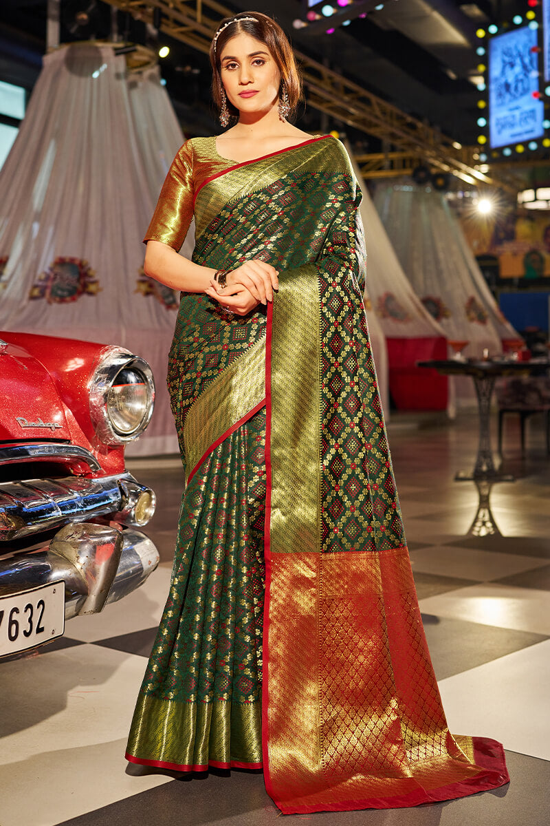 Beauteous Dark Green Patola Silk Saree with Pleasant Blouse Piece