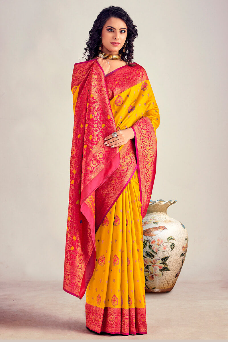 Beleaguer Yellow Soft Banarasi Silk Saree With Elision Blouse Piece