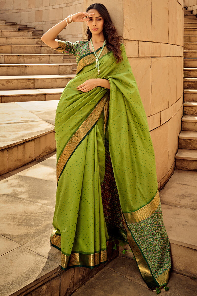 Ornate Green Patola Silk Saree with Tremendous Blouse Piece