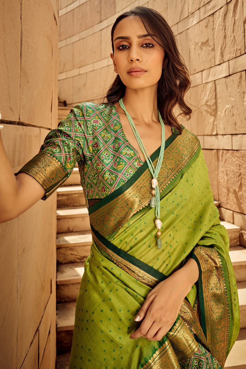 Ornate Green Patola Silk Saree with Tremendous Blouse Piece