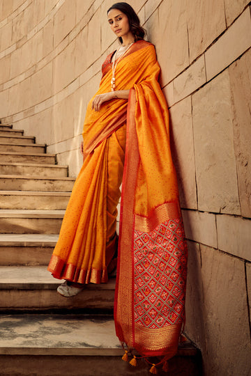 Staggering Orange Patola Silk Saree with Redolent Blouse Piece