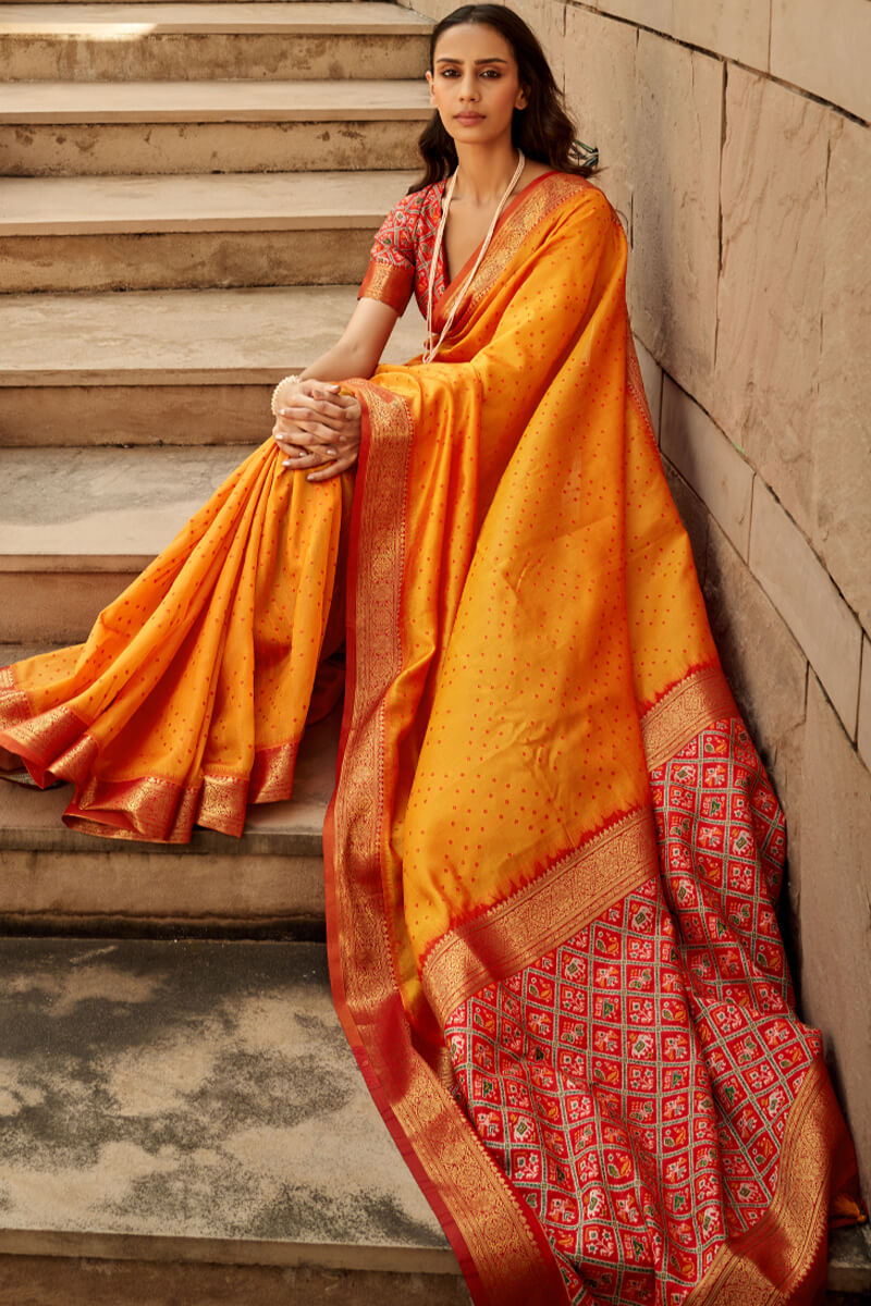 Staggering Orange Patola Silk Saree with Redolent Blouse Piece