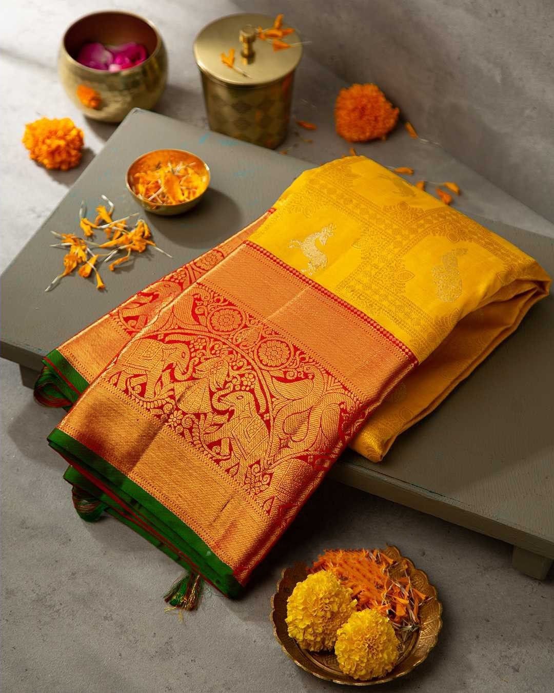 Brood Yellow Soft Banarasi Silk Saree With Cynosure Blouse Piece