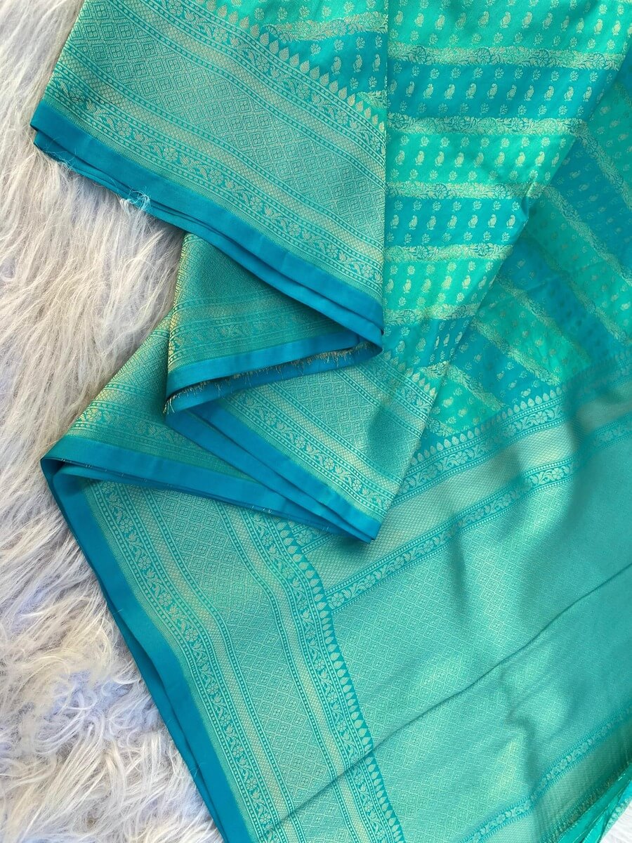 Desultory Firozi Soft Banarasi Silk Saree With Elision Blouse Piece